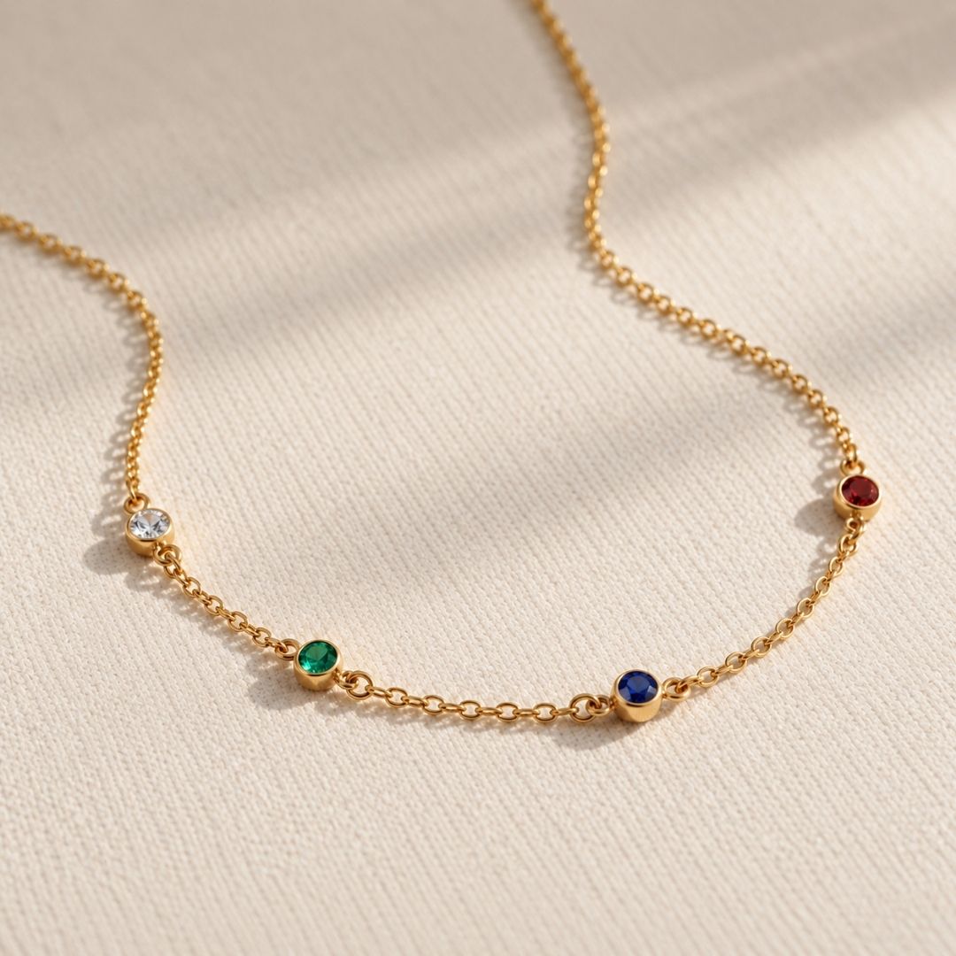 Gold Fable Necklace chain with clear, emerald, sapphire and ruby bezel birthstones