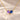 Demi Heart Necklace in gold with February amethyst and September sapphire pear-cut stones forming a heart