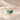 Demi Heart Necklace in gold with March aquamarine and May emerald pear-cut stones forming a heart
