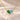 Demi Heart Necklace in gold with May emerald and March aquamarine pear-cut stones forming a heart