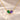 Demi Heart Necklace in gold with May emerald and June alexandrite pear-cut stones forming a heart