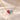 Demi Heart Necklace in gold with July ruby and March aquamarine pear-cut stones forming a heart