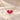 Demi Heart Necklace in gold with two July ruby pear-cut stones forming a heart