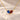 Demi Heart Necklace in gold with September sapphire and January garnet pear-cut stones forming a heart