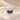 Demi Heart Necklace in gold with two September sapphire pear-cut stones forming a heart