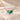 Demi Heart Necklace in gold with December zircon and May emerald pear-cut stones forming a heart