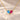 Demi Heart Necklace in gold with December zircon and July ruby pear-cut stones forming a heart