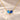 Demi Heart Necklace in gold with December zircon and September sapphire pear-cut stones forming a heart